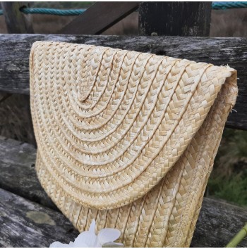 Includes woven lining Straw clutch