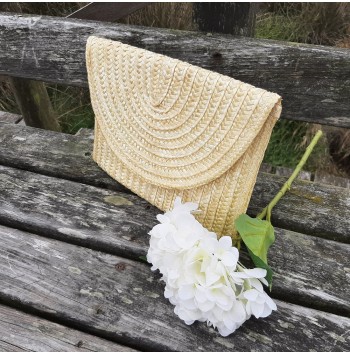 Includes woven lining Straw clutch