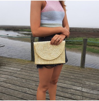 Includes woven lining Straw clutch